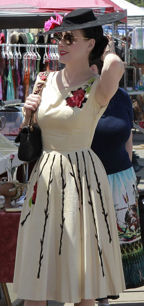 Dita von Teese Chanel bag flowers dress hat