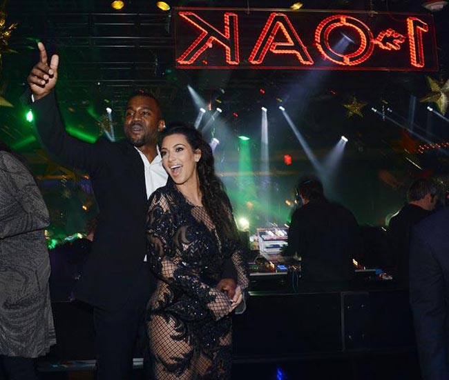 Kanye Kim Kardashian holding her baby bump
