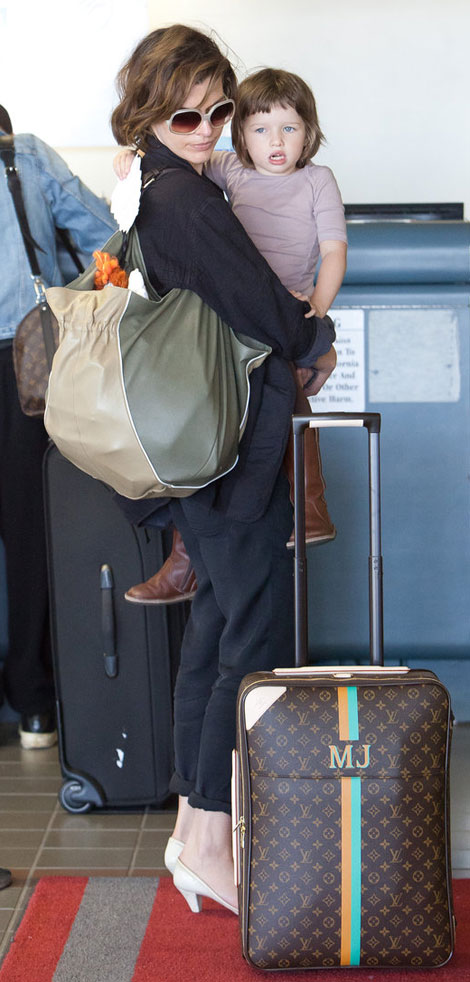 Milla Jovovich Louis Vuitton travel suitcase