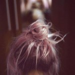 pink hair in a messy bun
